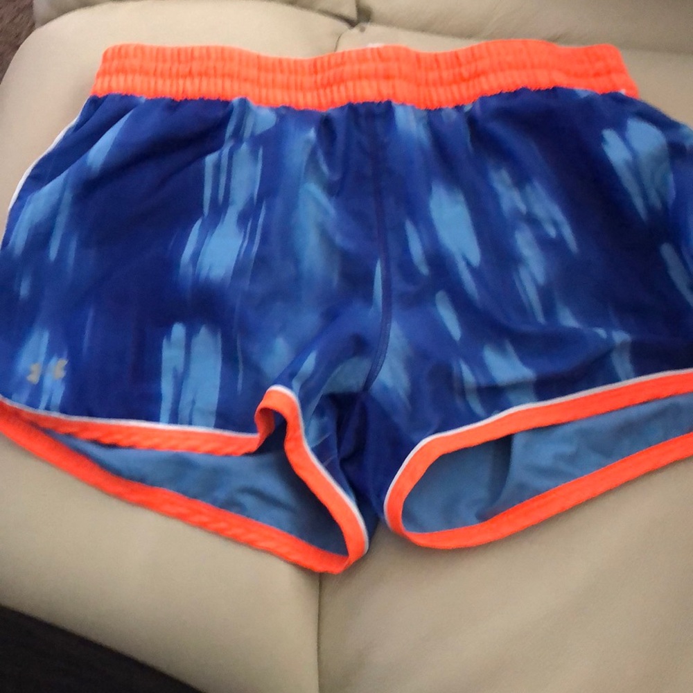 Under Armour blue shorts with neon orange stripes